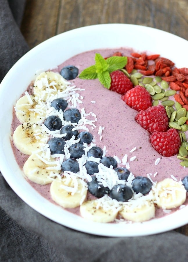 This nutrient dense Acai Berry Smoothie bowl makes for a great breakfast or lunch substitute. gardneinthekitchen.com