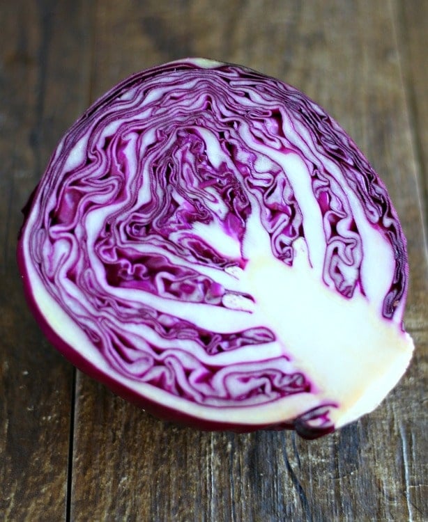 A purple cabbage sliced in half.