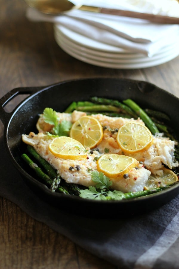 This Baked Cod recipe is incredibly easy to make and only takes 25-minutes. A truly perfect meal for a busy week night! gardeinthekitchen.com