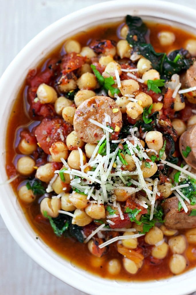 Sausage chickpea Stew in a white bowl
