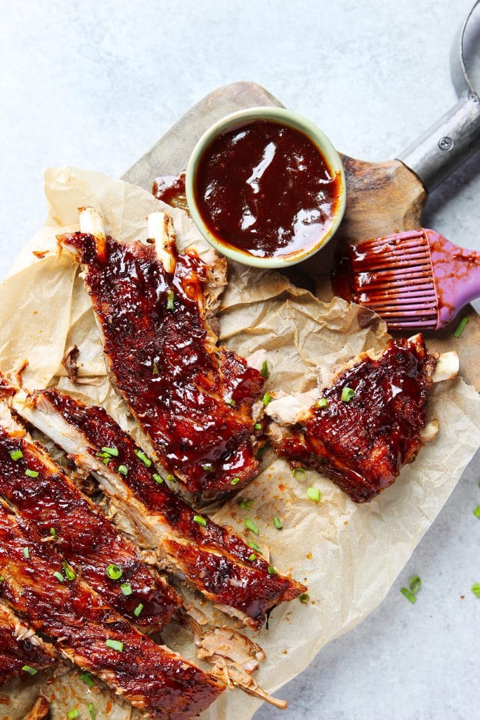 rack of ribs with BBQ sauce. A brush with sauce. 