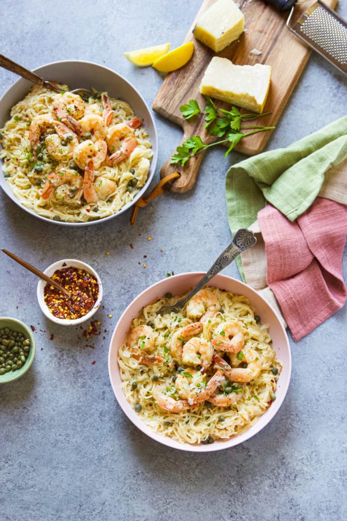 3-minute Instant Pot Shrimp Scampi with angel hair pasta, cooked in a fragrant shallot-wine broth, topped with capers and fresh parsley!