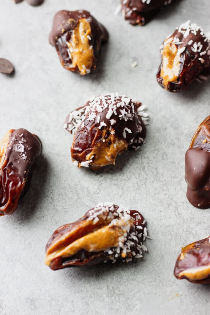 A few dates covered with chocolate and coconut flakes