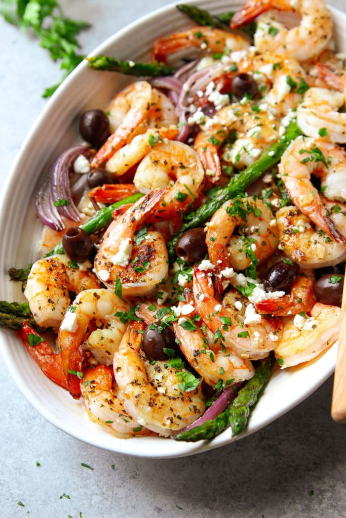 Healthy shrimp recipe with vegetables in a white oval plate