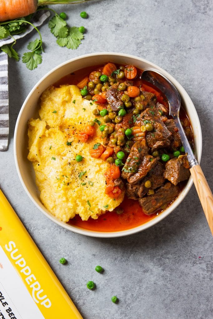 instant pot beef stew with carrots, peas and creamy polenta. 