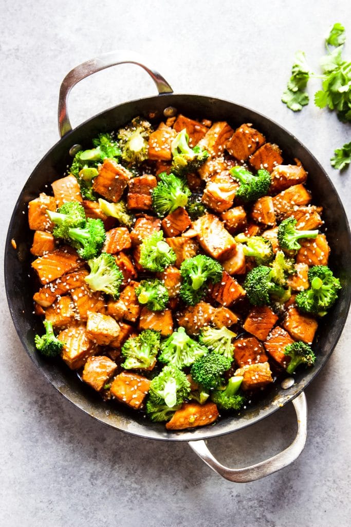 salmon and broccoli stir fry in a large skillet