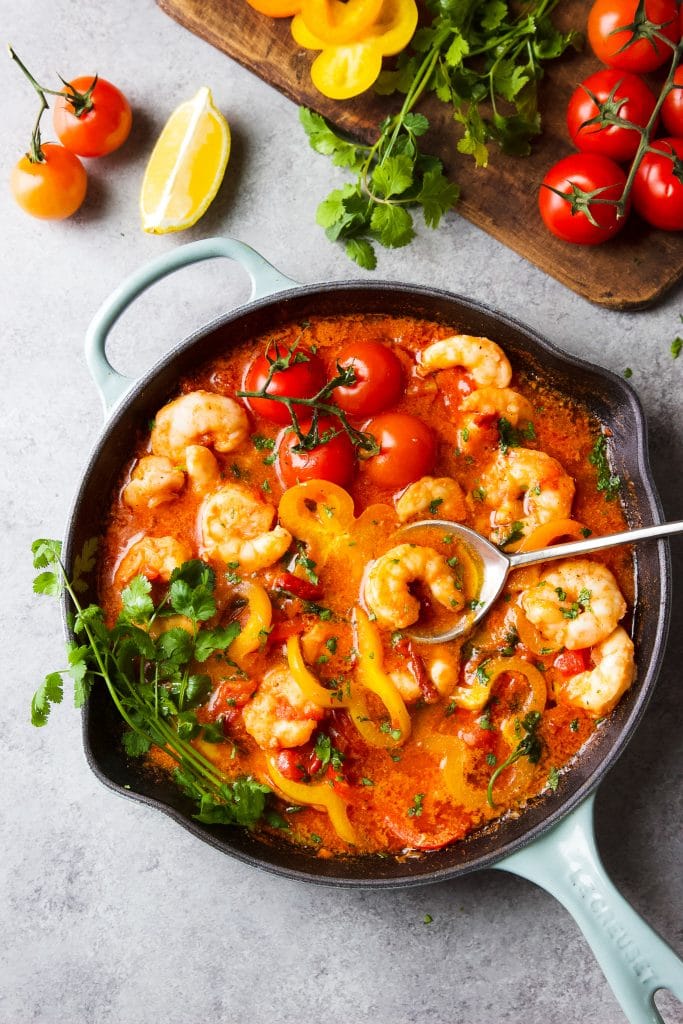 shrimp stew (moqueca de camarão) in tomato and coconut milk sauce. Fresh tomato, bell pepper and cilantro are part of this dish. 