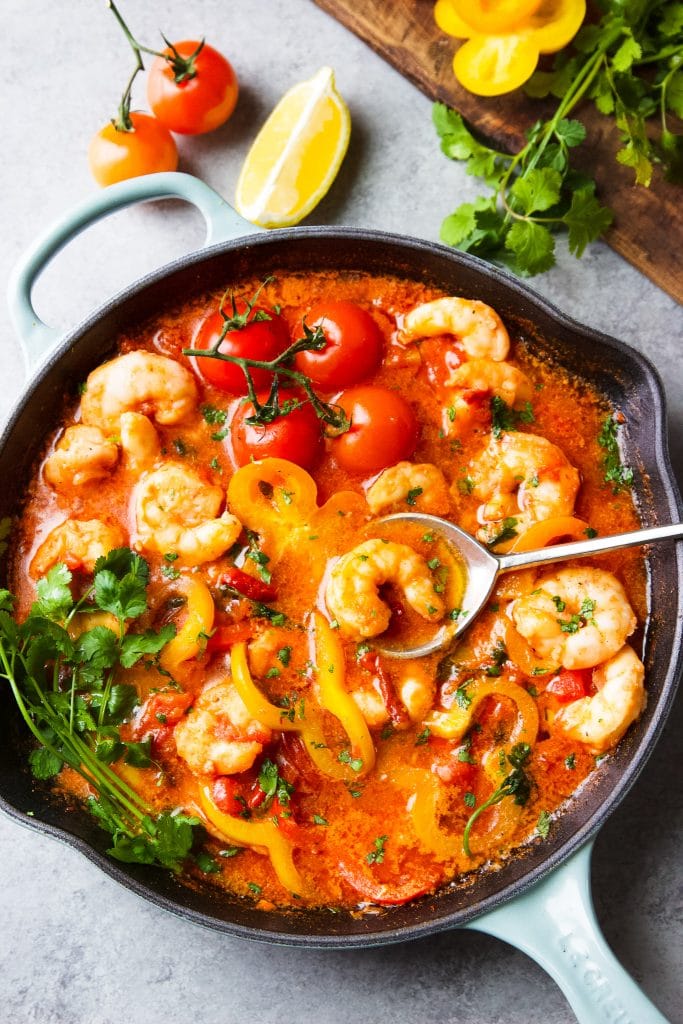 shrimp stew (moqueca de camarão) in tomato and coconut milk sauce. Fresh tomato, bell pepper and cilantro are part of this dish. 