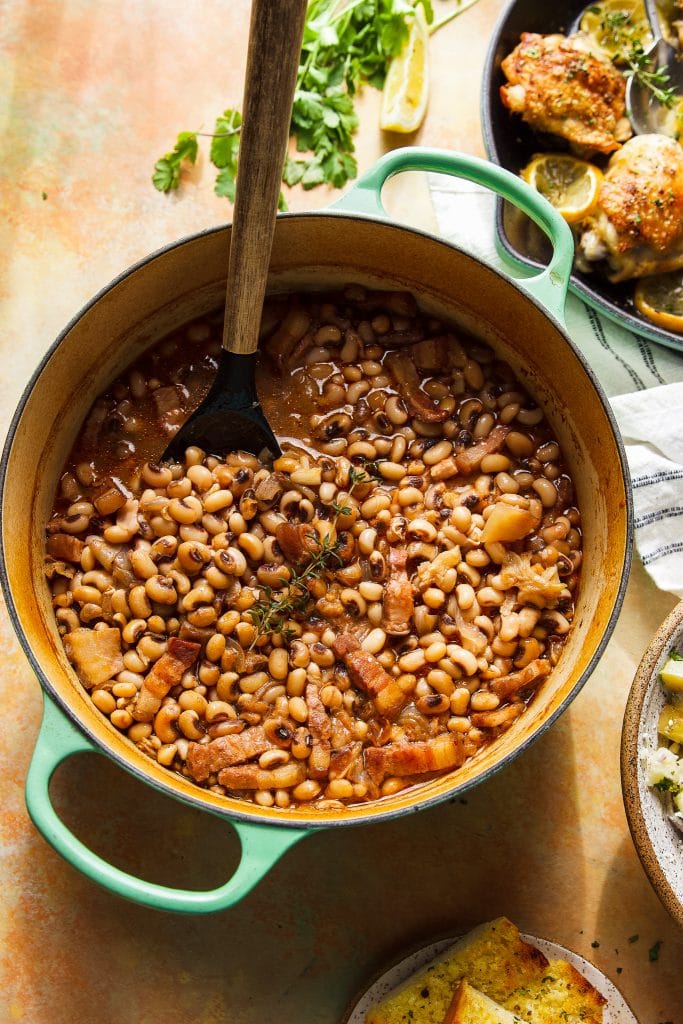 southern black eyed peas in a pot with wooden spoon. 