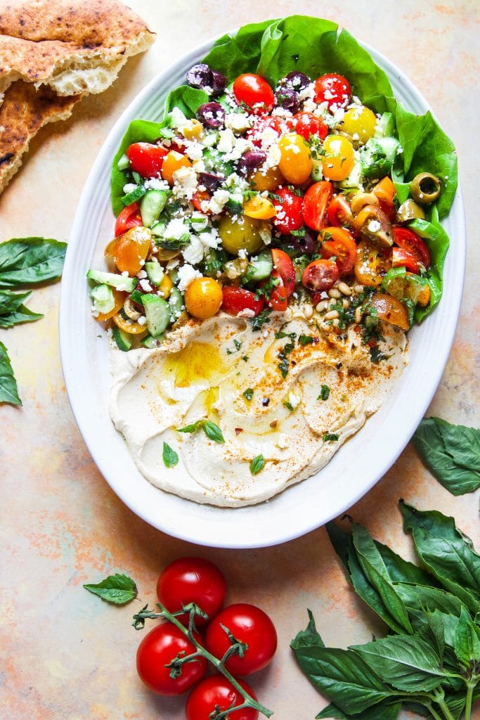 This Mediterranean Hummus Salad brings creamy hummus and vibrant fresh vegetables together to create a delightfully light summer dish. 