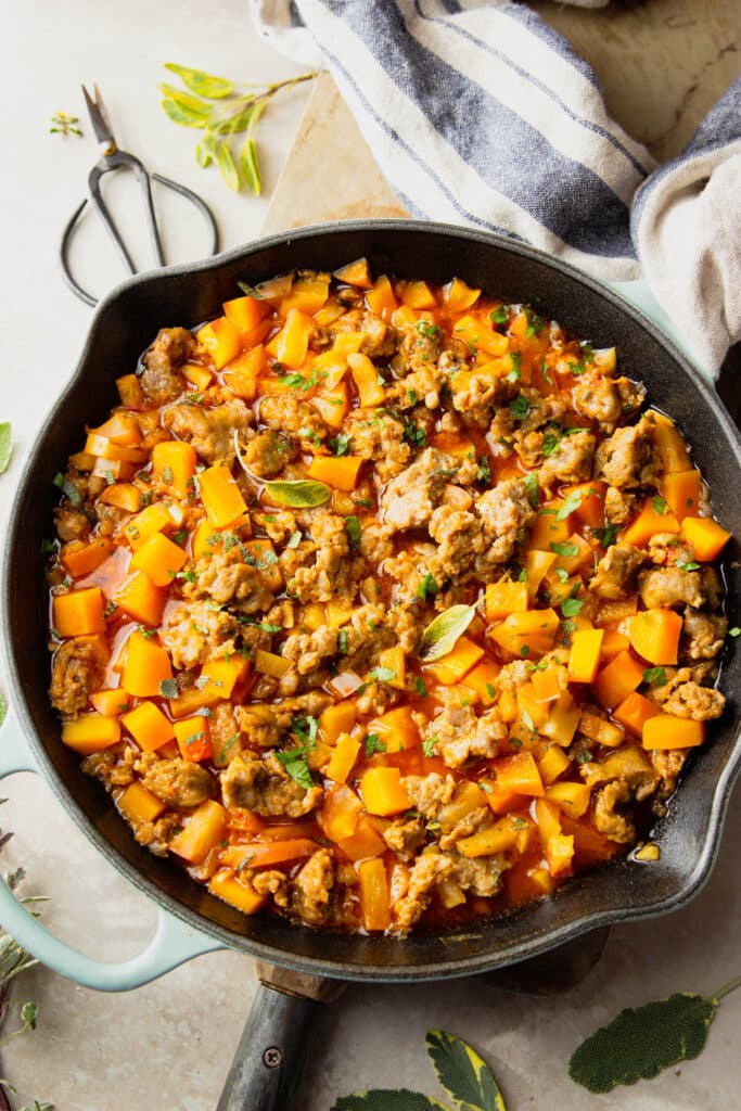 Sausage and butternut squash dinner in cast iron skillet