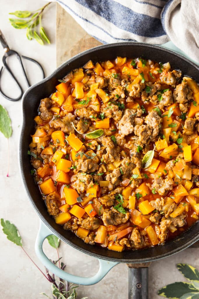 sausage and butternut squash dinner in cast iron skillet