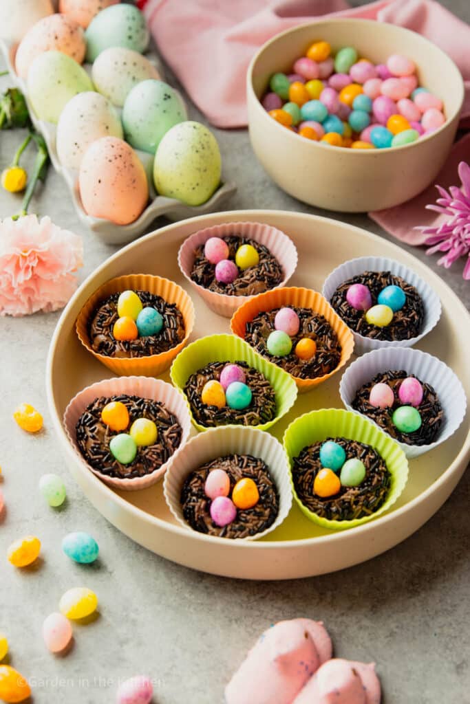 Brazilian brigadeiro with jelly beans in silicone molds. Jelly beans and Easter eggs on the table. 