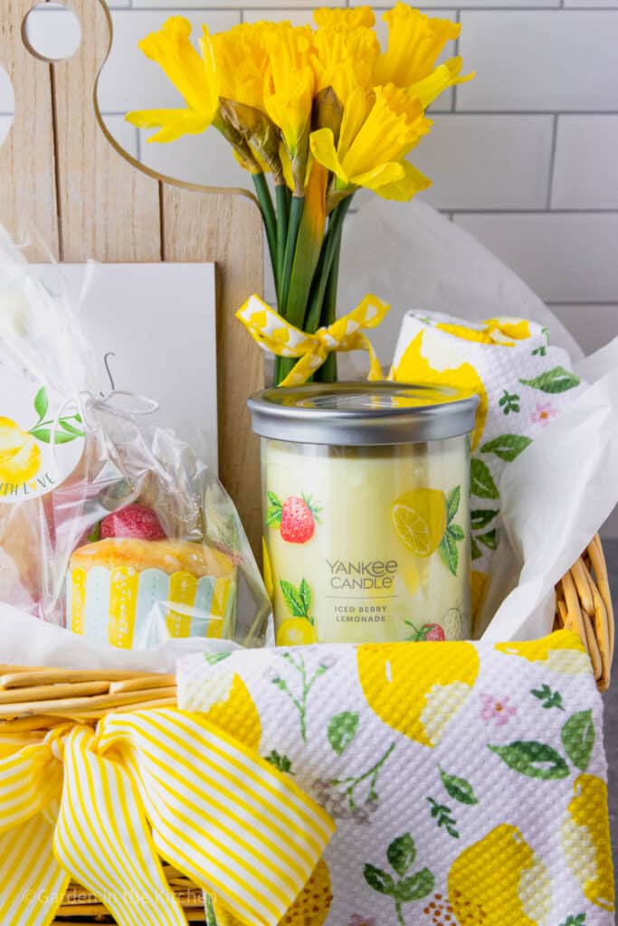 A Mother's Day gift basket she won't soon forget! Gluten-free lemon cupcakes and large Signature jar of Iced Berry Lemonade by Yankee Candle in a basket with a big yellow bow!