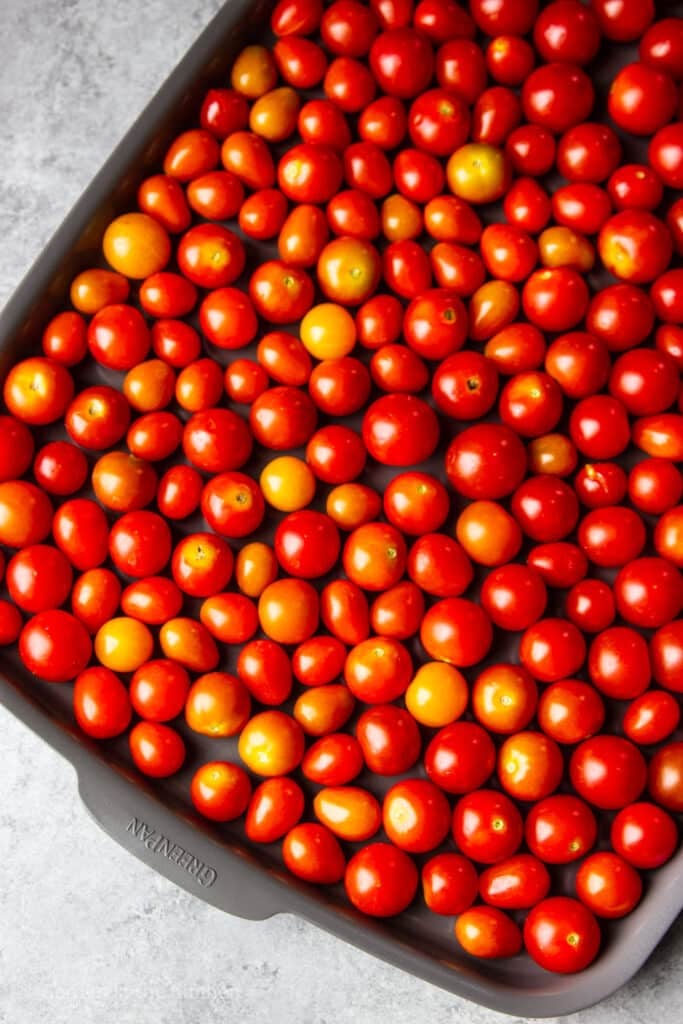 Cherry tomatoes on a baking sheet.