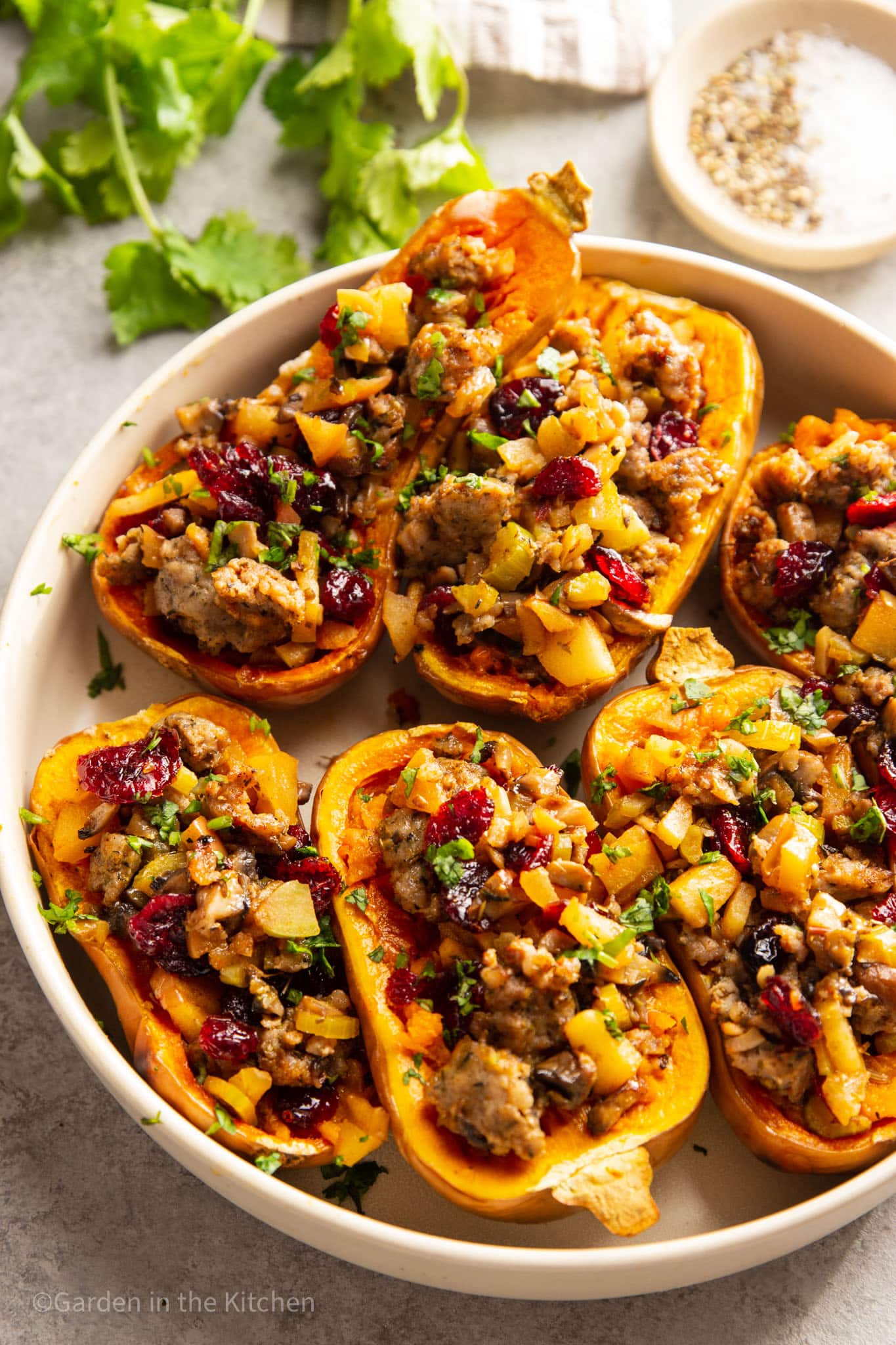 Honey nut squashes stuffed with sausage, apple and cranberry mix.