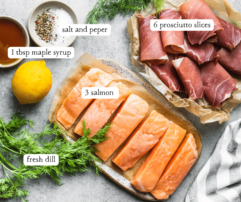 ingredients for prosciutto wrapped salmon on individual white plates.