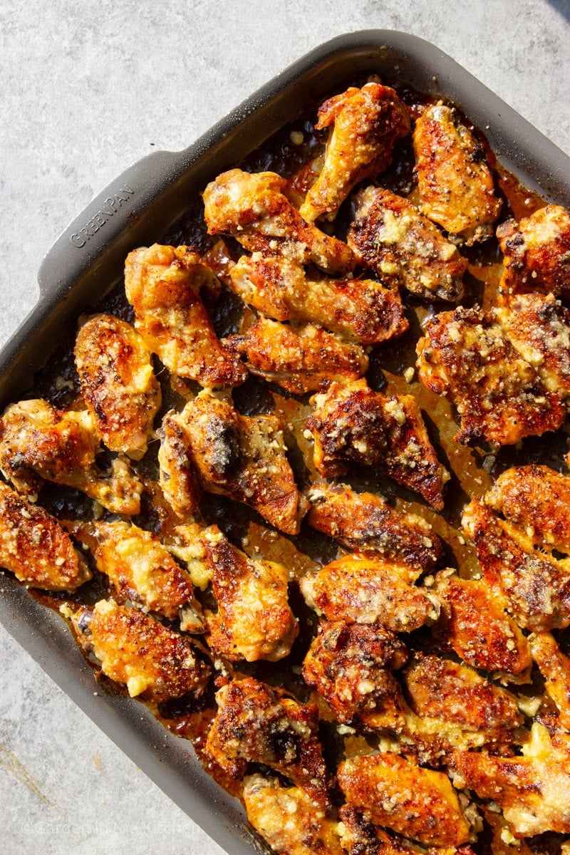 Oven baked garlic parmesan chicken wings in a sheet pan. 