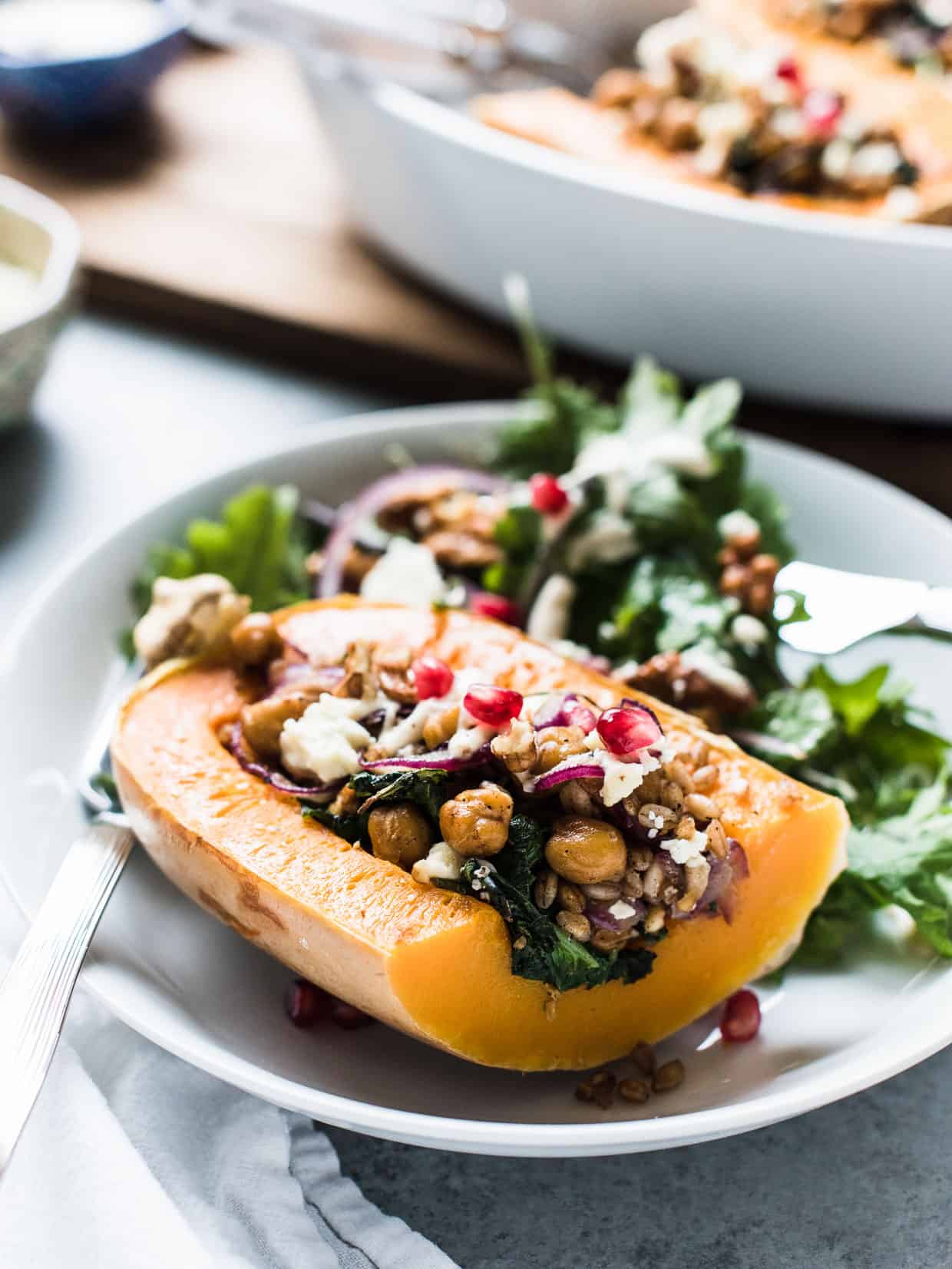 Stuffed butternut squash with chickpeas, onions, pomegranates, farro, kale and feta cheese.