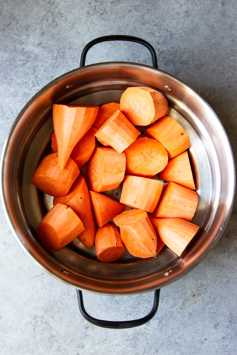 Sweet potatoes in a steamer basket.