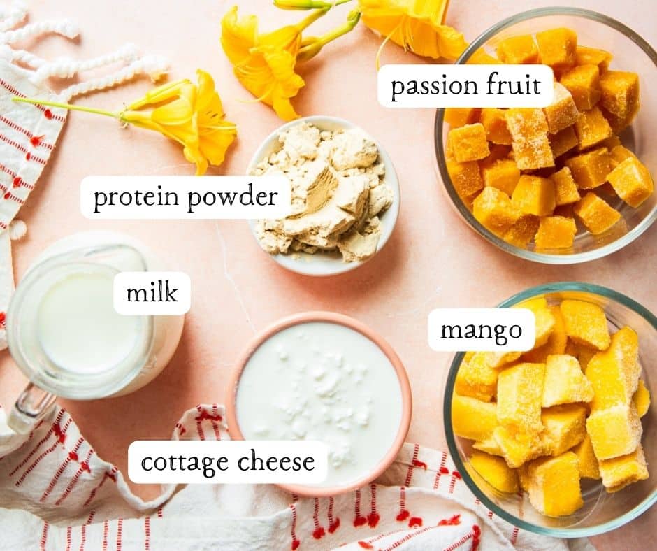 Flowers, red and white dish towel, passion fruit, protein powder, milk, cottage cheese and mango.