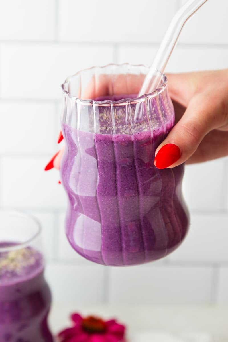 Blueberry Beet Protein Smoothie and a flower.