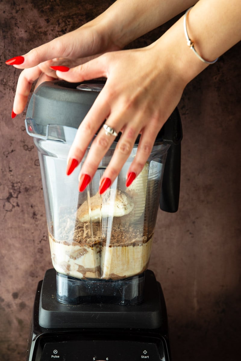 Chocolate Coffee Protein Smoothie ingredients in a blender. 