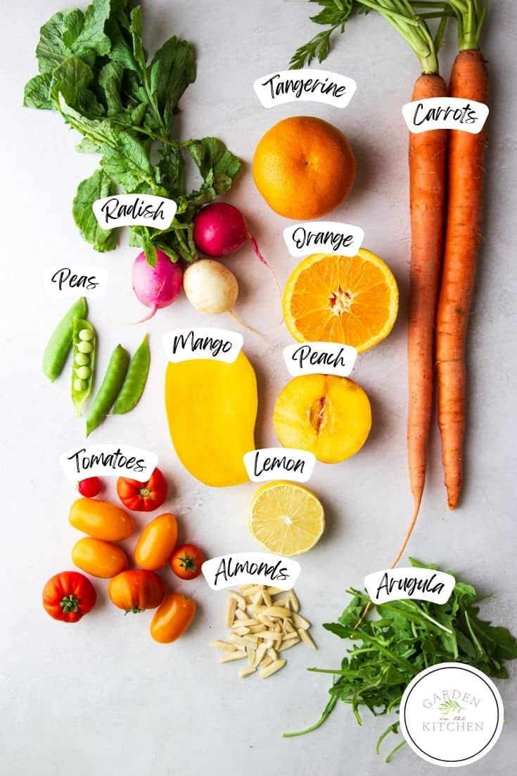 Radishes, tangerine, orange, carrots, peas, mango, peach, lemon, tomatoes, almonds, arugula.