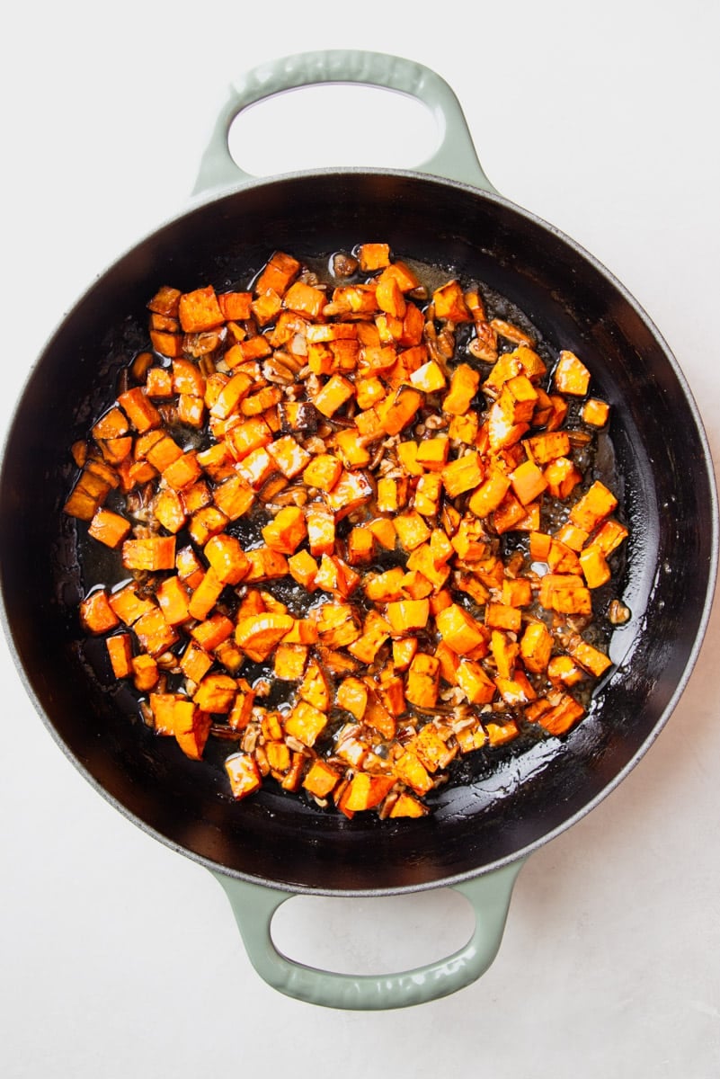 Diced sweet potatoes in a skillet. 