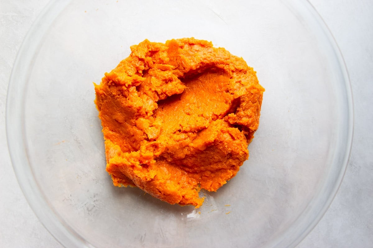 mashed sweet potato in a glass bowl. 