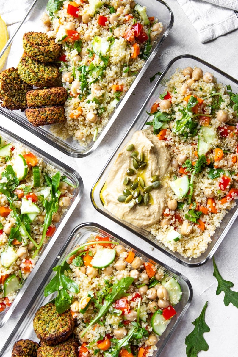 Quinoa chickpea lunch bowls with falafel, hummus, arugula.