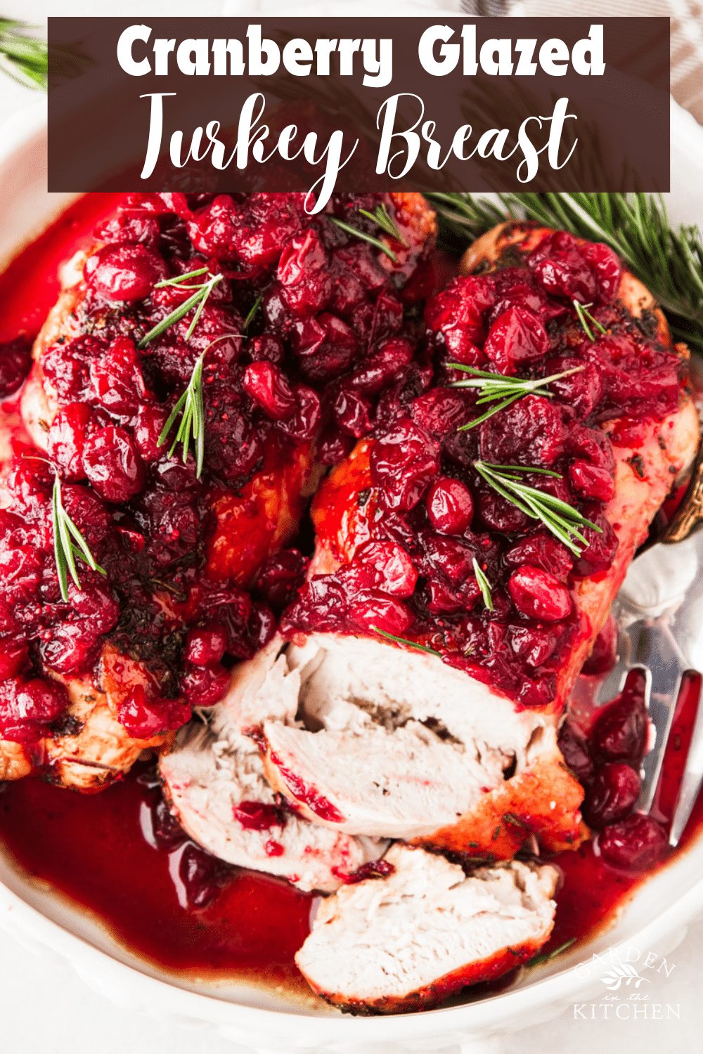 Plaid dish towel, cranberries, fresh rosemary, cranberry glazed turkey breasts.