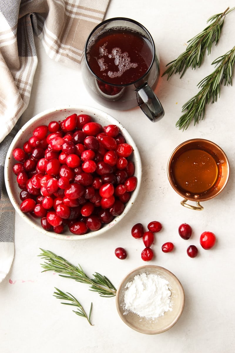 Plaid dish towel, fresh rosemary, cranberry juice, honey, cranberries, and cornstarch.