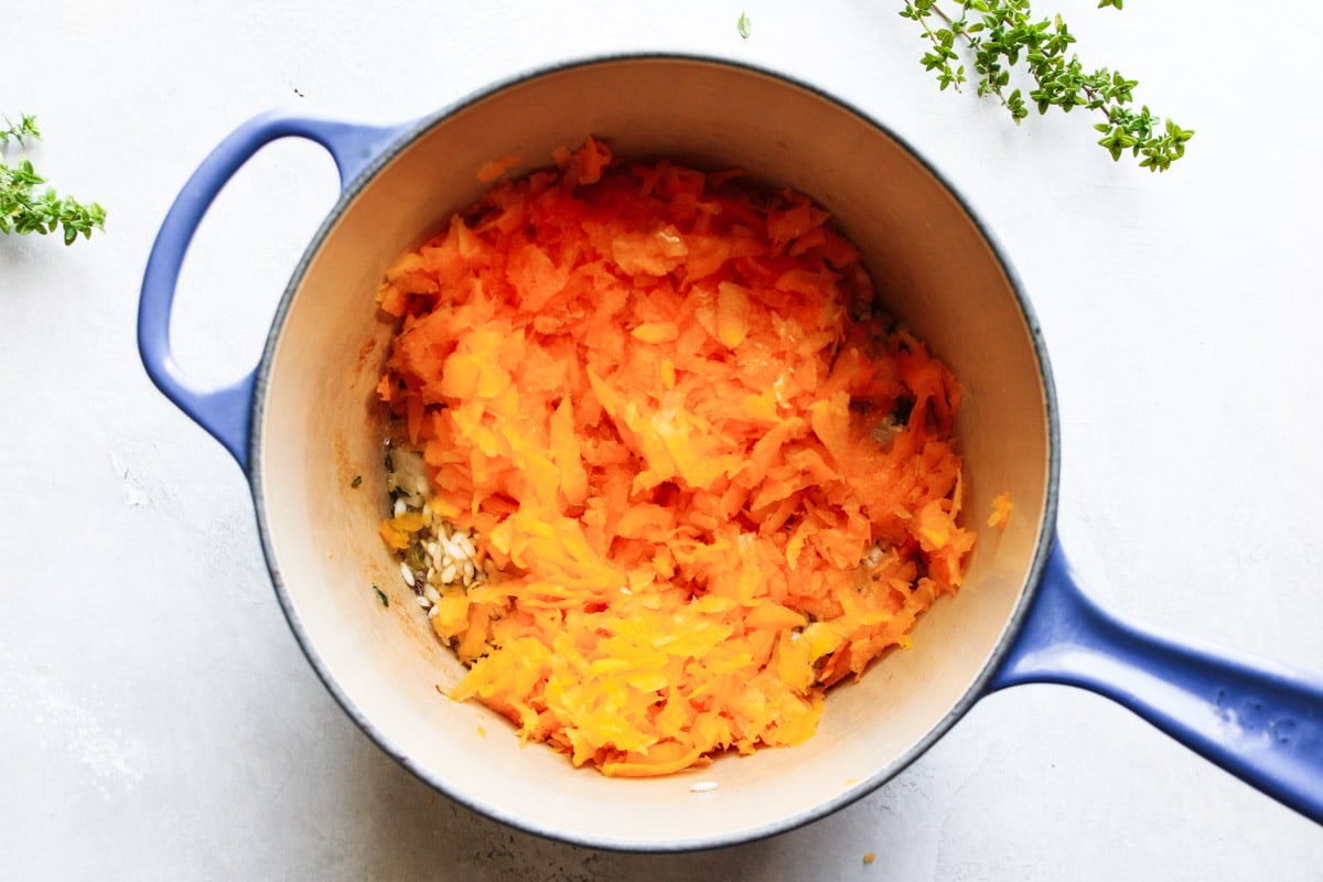 Grated squash added to the blue pot and fresh thyme. 