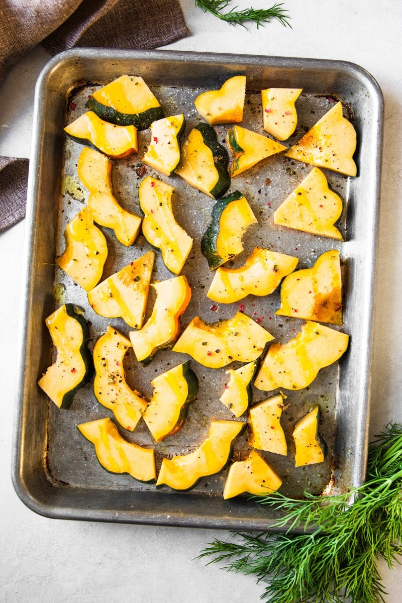 Slices of squash on a cookie sheet. 