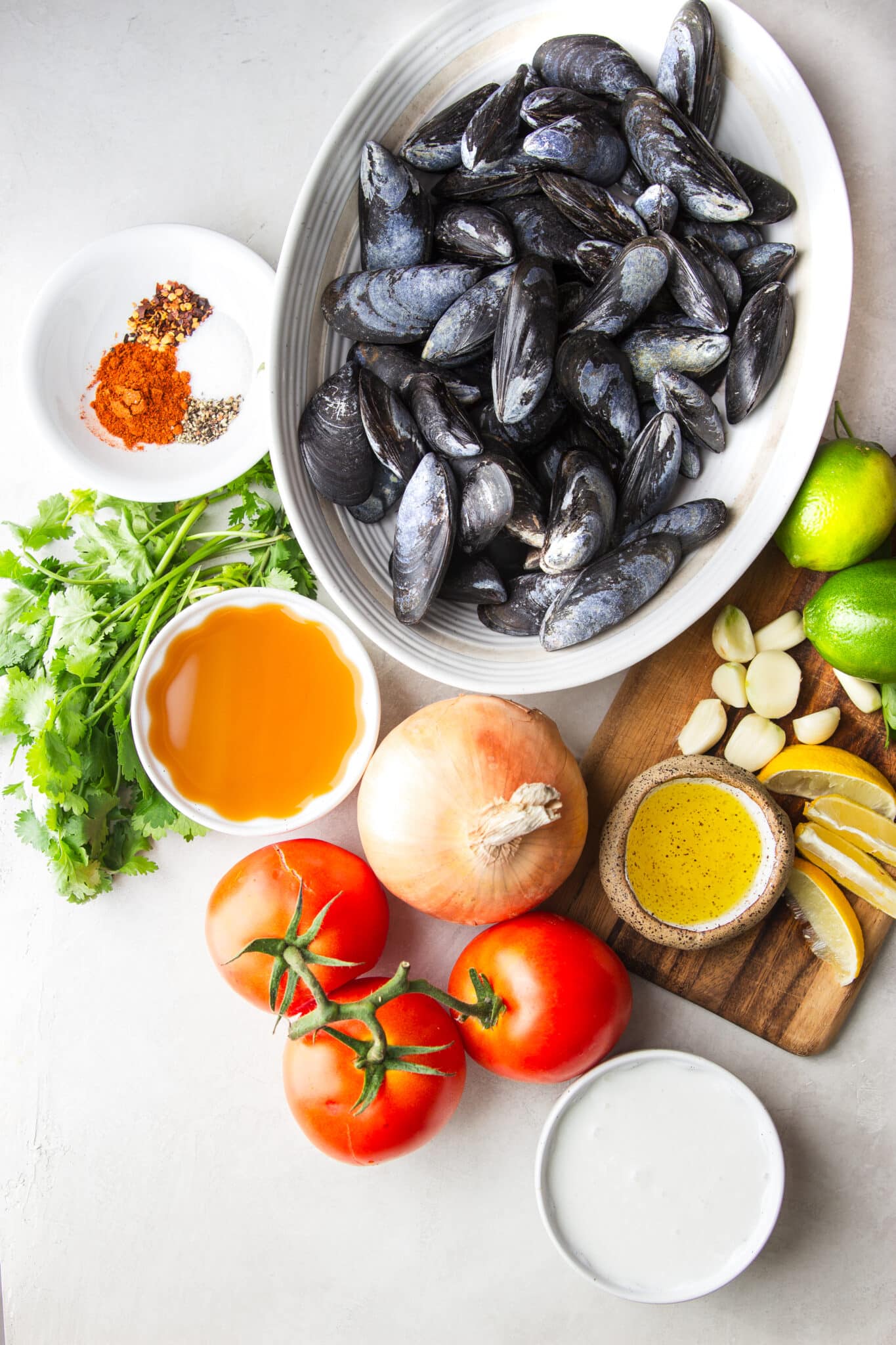 Tender mussels simmered in a flavorful tomato coconut broth with garlic, saffron, and fresh cilantro. This easy Brazilian-inspired seafood dinner is ready in just 30 minutes