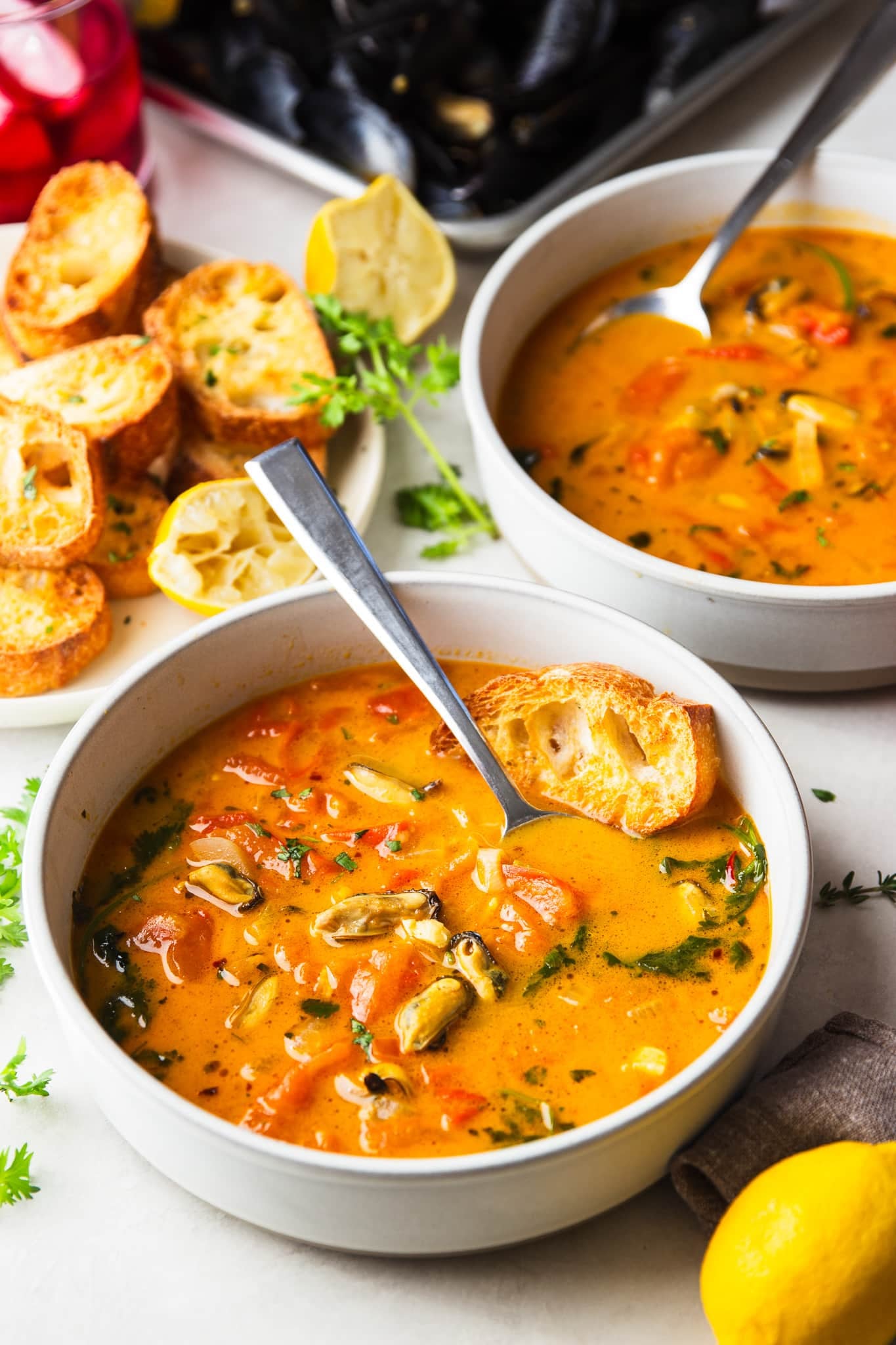 Tender mussels simmered in a flavorful tomato coconut broth with garlic, saffron, and fresh cilantro. This easy Brazilian-inspired seafood dinner is ready in just 30 minutes