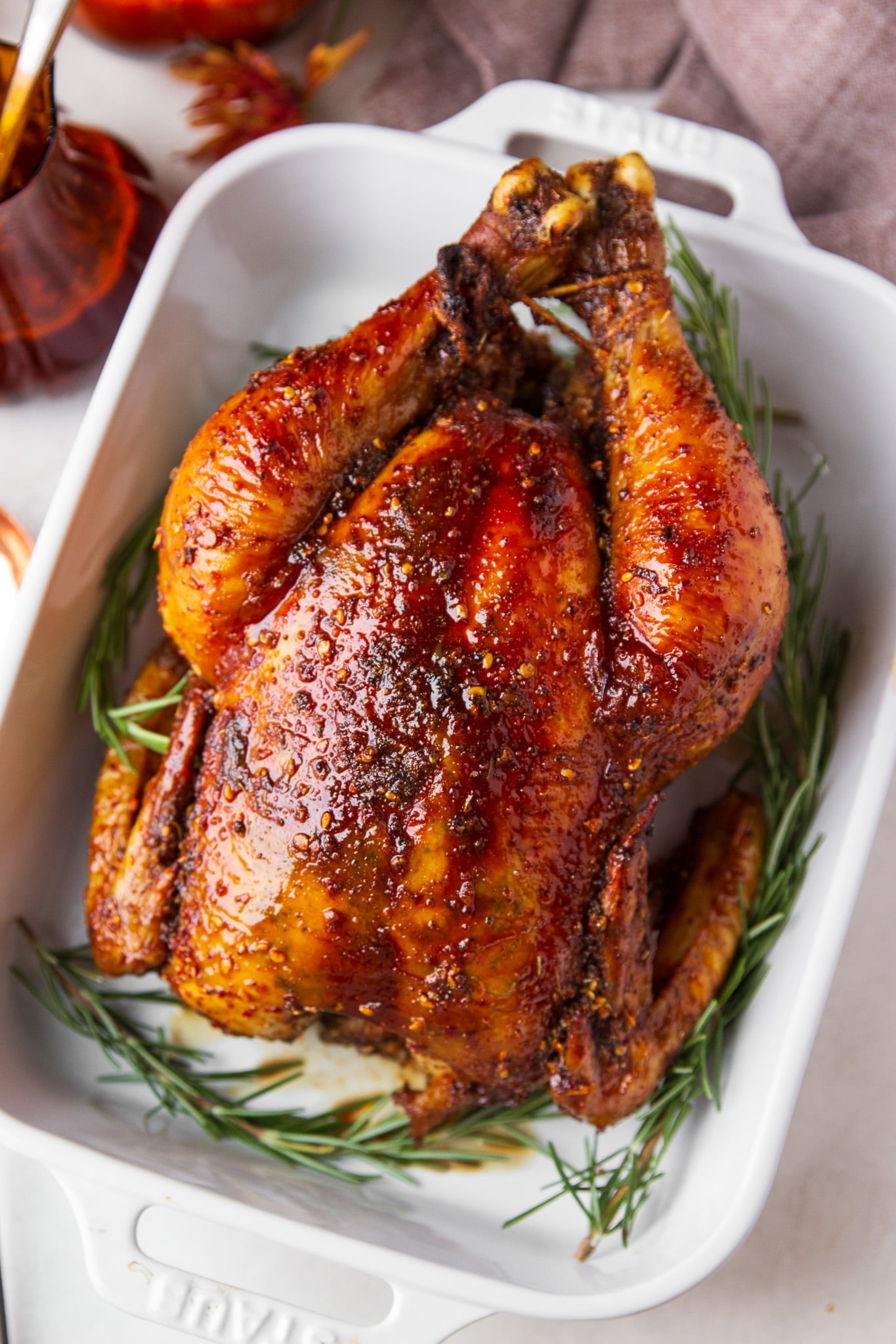 Hot honey roasted chicken with crispy golden skin and a sticky chili crunch glaze. Sweet, spicy, savory and packed with flavor.