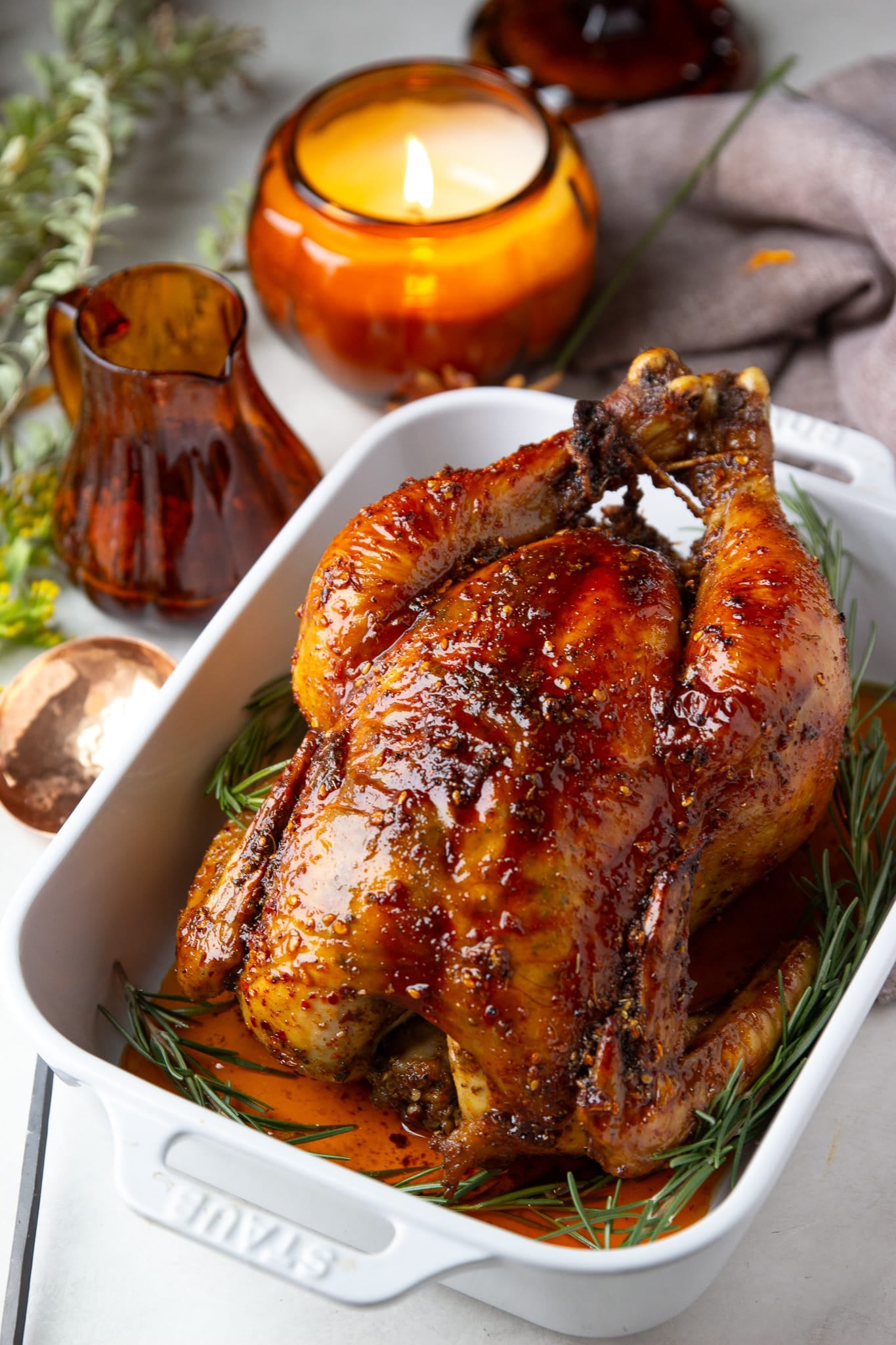 Hot honey roasted chicken with crispy golden skin and a sticky chili crunch glaze. Sweet, spicy, savory and packed with flavor.