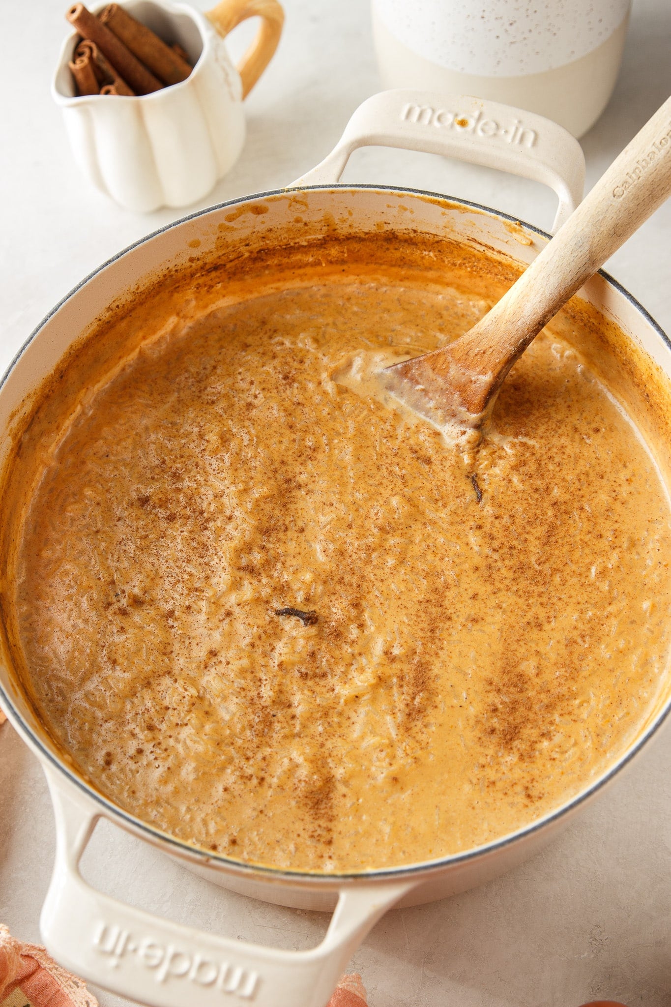 Creamy pumpkin rice pudding inspired by Brazilian arroz doce, made with condensed, evaporated and whole milk plus cinnamon and warm fall spices.