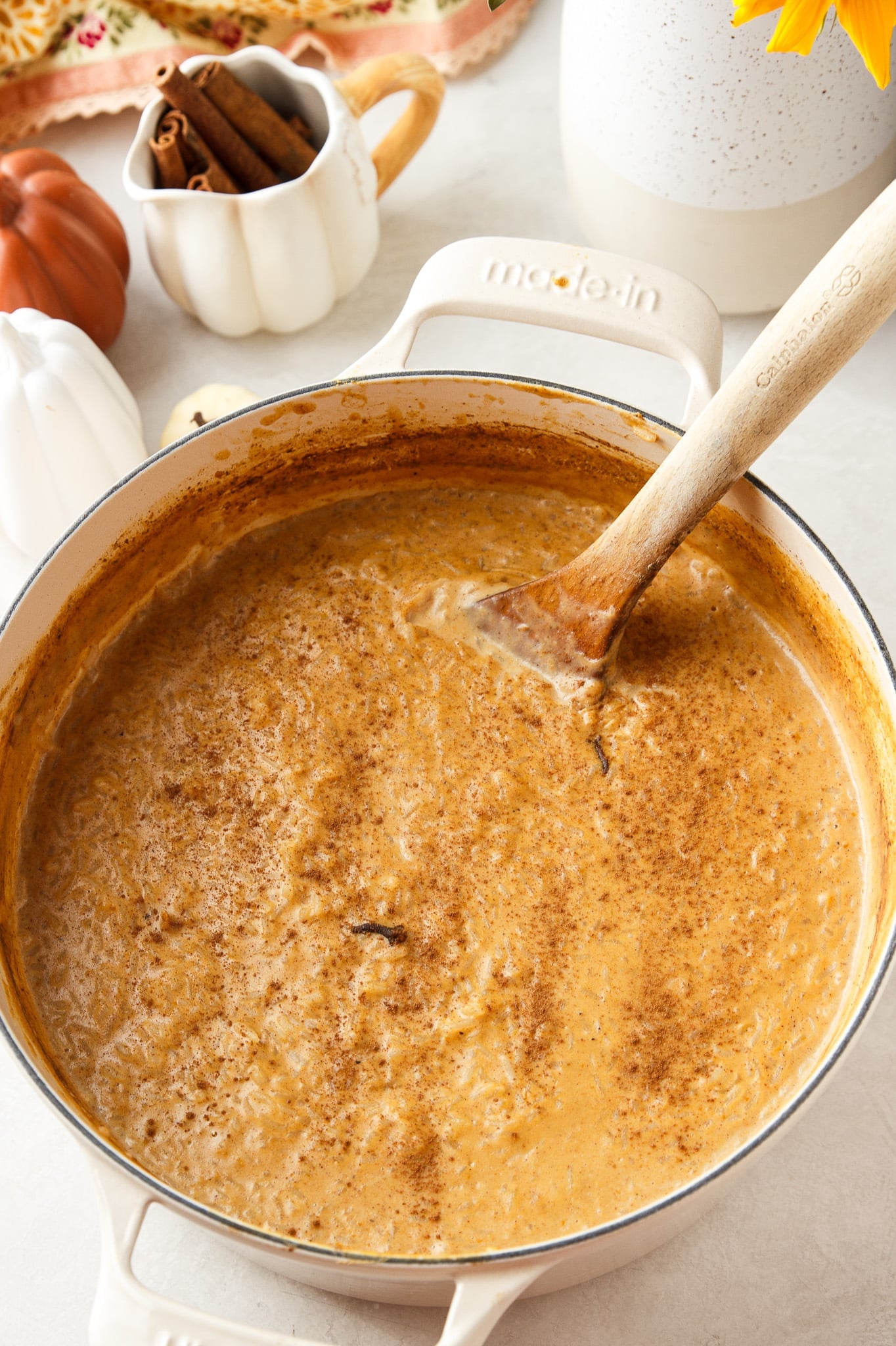 Creamy pumpkin rice pudding inspired by Brazilian arroz doce, made with condensed, evaporated and whole milk plus cinnamon and warm fall spices.
