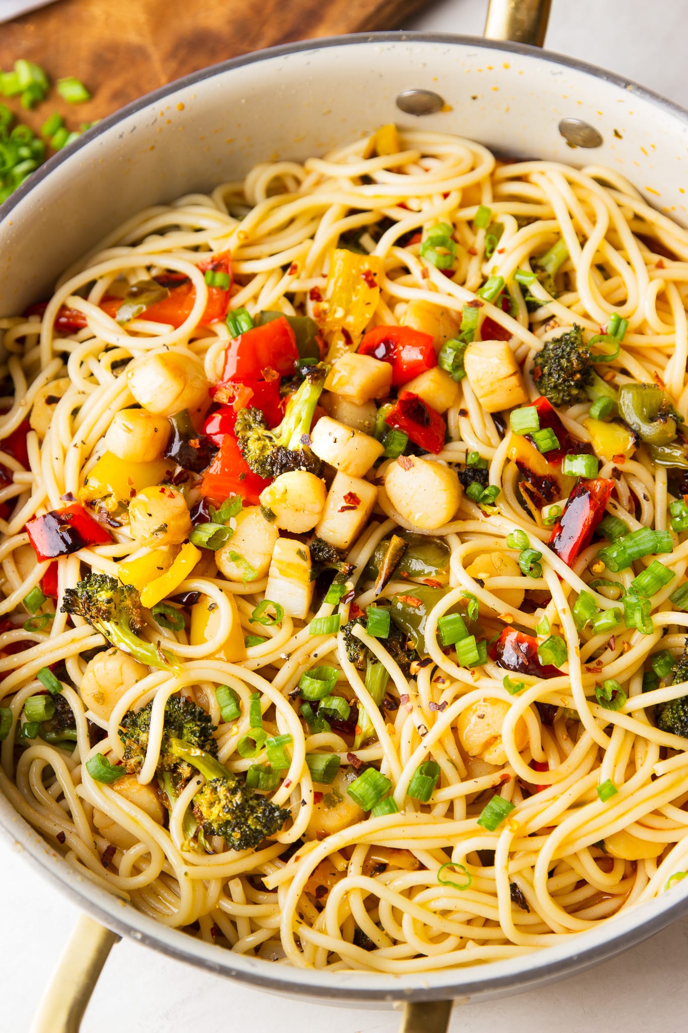 Gochujang scallop pasta combines tender scallops, roasted vegetables and spaghetti in a sweet and spicy butter sauce for an easy 30-minute dinner.